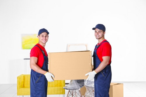Furniture and boxes being loaded by a local moving team in Eastsheen