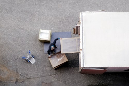 Loading furniture into a van on an Eastsheen residential street