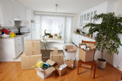 Packed moving boxes and furniture in a local Eastsheen home