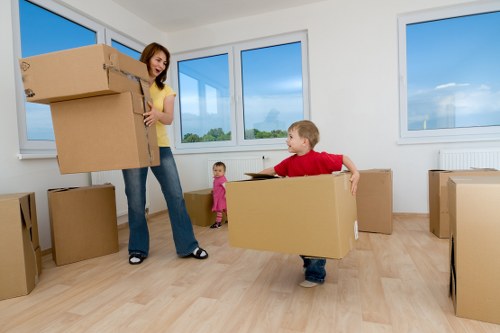 Local removals van loading furniture in Eastsheen